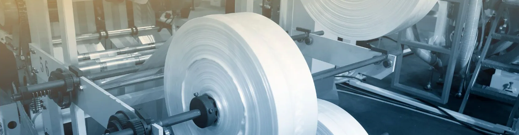 Rolls of plastic film on a bag-making line
